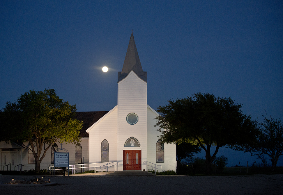 160322 TAYLOR, TEXAS:   Immanuel Lutheran Church, on County Road 401, shares a piece of  the sky with a full moon on Tuesday evening. Photo by Andy Sharp.  20