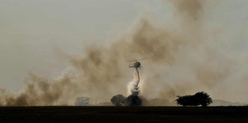 Containing a fire in a farmer's field in Thrall, Texas.